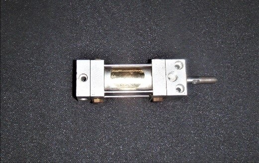 Schrader Unknown Model Gold Medallion Mini Cylinder